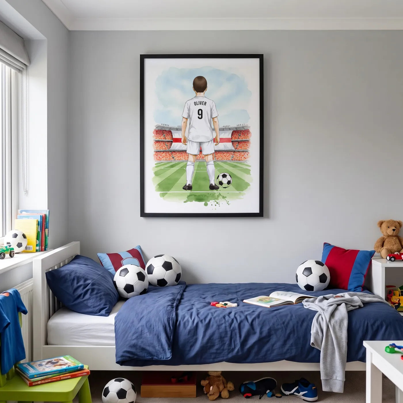 A personalised football player print in a black frame on a child's bedroom wall